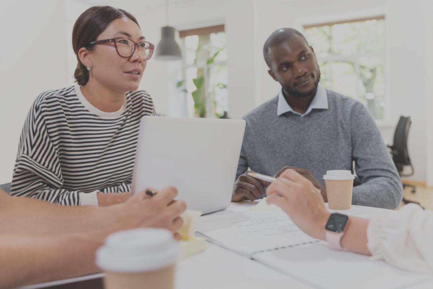 Professional business planning session with financial documents and calculators